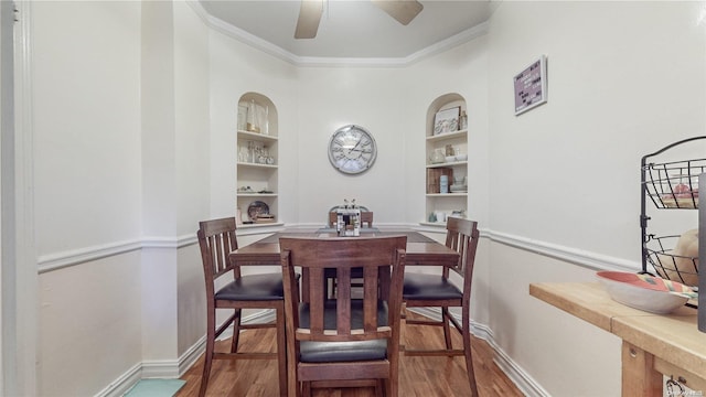 84-51 Beverly Rd Unit 4P, Kew Gardens, NY 11415 - dining room featuring built in shelves, wood finished floors, baseboards, ornamental molding, and ceiling fan