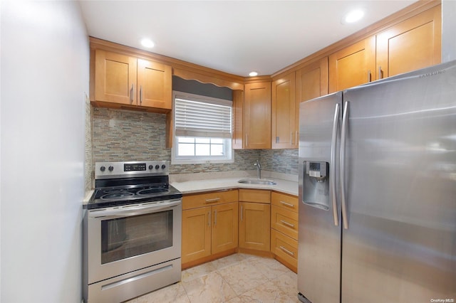 kitchen featuring tasteful backsplash, sink, and stainless steel appliances