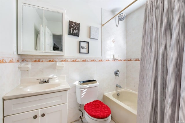 full bathroom featuring vanity, toilet, tile walls, and shower / tub combo