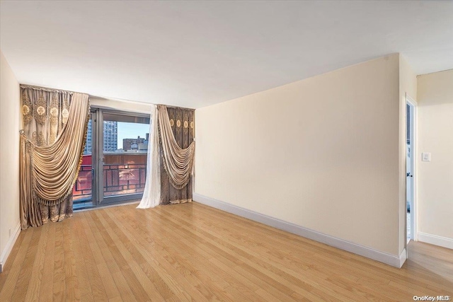 unfurnished room featuring light hardwood / wood-style flooring