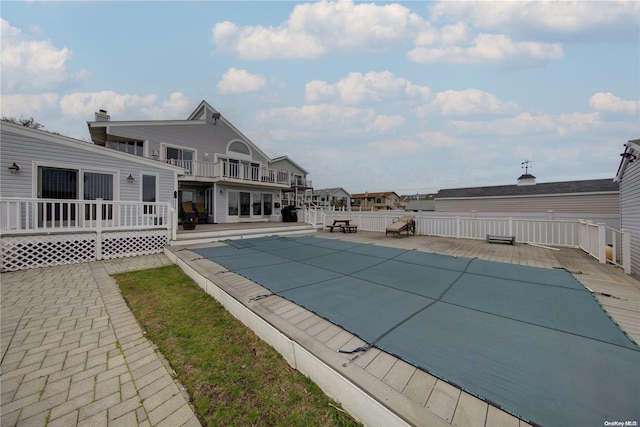 view of swimming pool with a patio area