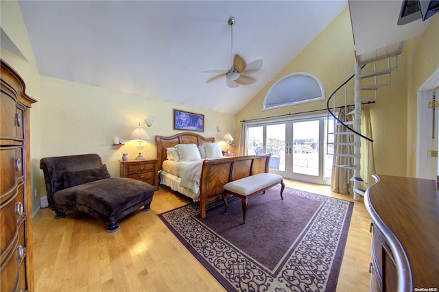 bedroom with french doors, access to outside, ceiling fan, high vaulted ceiling, and light hardwood / wood-style floors