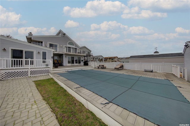 view of swimming pool with a patio