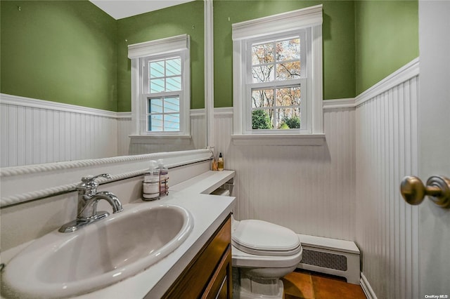 bathroom featuring tile patterned floors, vanity, and toilet