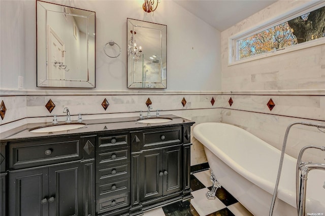 bathroom featuring a bath, vanity, and tile walls