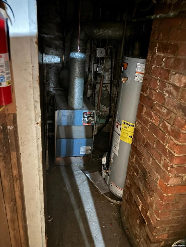 utility room featuring gas water heater