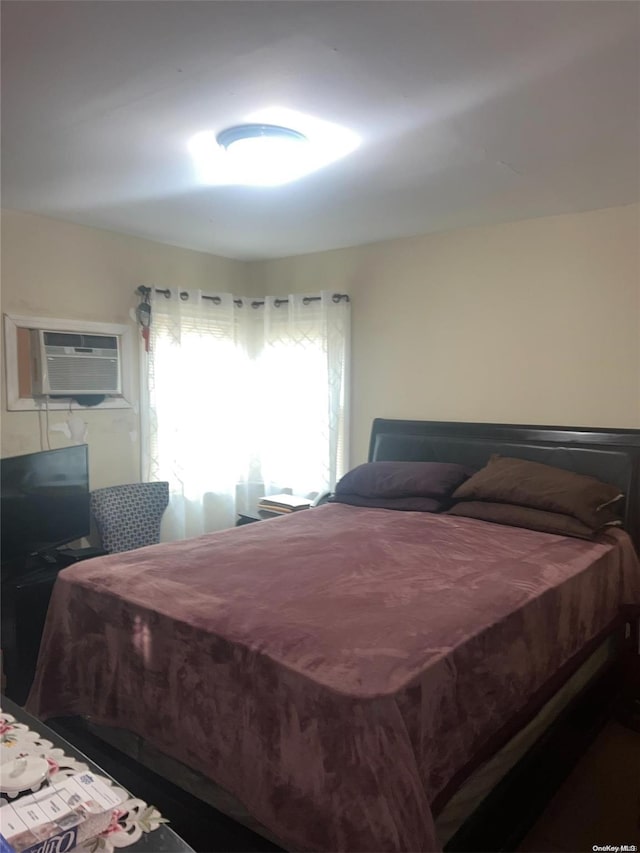 bedroom featuring a wall unit AC and billiards