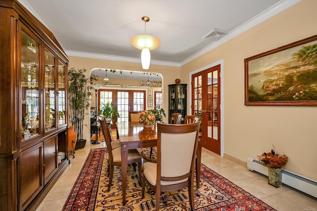 dining room featuring visible vents, crown molding, french doors, a baseboard heating unit, and light tile patterned flooring