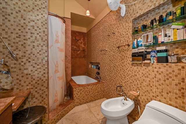 bathroom featuring toilet, tile walls, vaulted ceiling, a tile shower, and a bidet