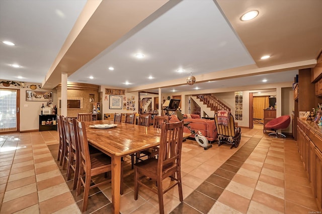 dining room featuring light tile patterned floors, stairs, baseboards, and recessed lighting