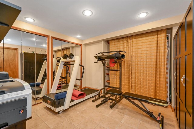 exercise room with recessed lighting