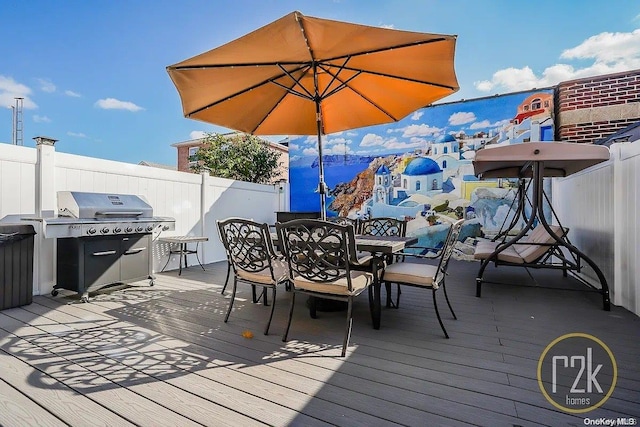 wooden deck featuring grilling area