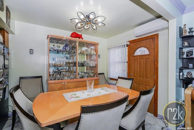 dining room featuring an AC wall unit and a notable chandelier