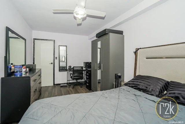 bedroom with ceiling fan and dark hardwood / wood-style floors