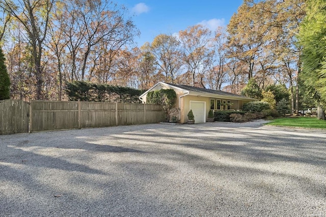 view of side of property featuring a garage