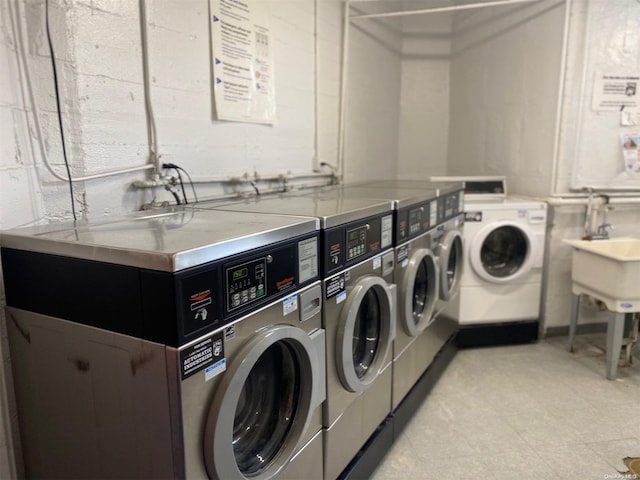 laundry room featuring sink and washer and dryer