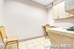 laundry room featuring light tile patterned floors