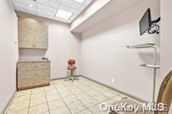 washroom featuring light tile patterned flooring