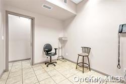 sitting room featuring light tile patterned floors