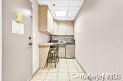 kitchen featuring light tile patterned flooring