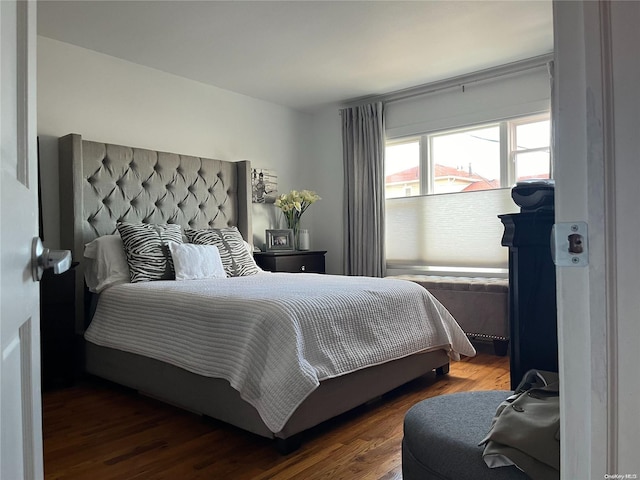 bedroom featuring dark hardwood / wood-style flooring