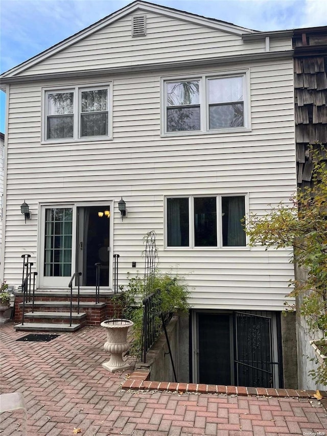 rear view of house featuring a patio