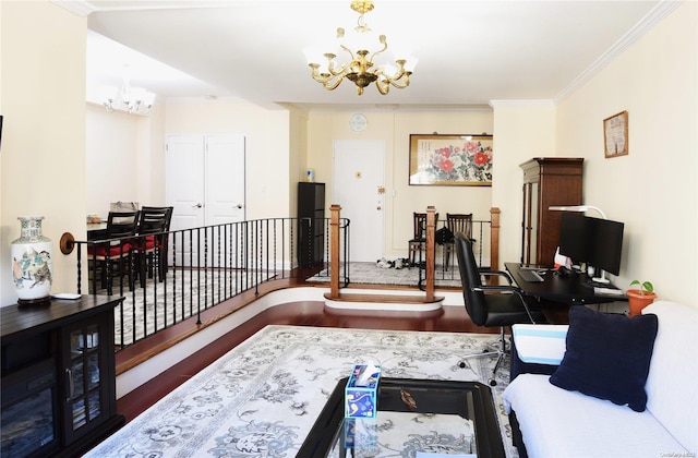 living room featuring crown molding, wood-type flooring, and a notable chandelier