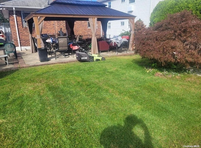 view of yard featuring a gazebo and a patio