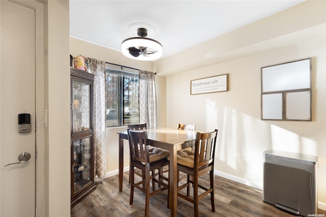 dining room with dark wood-type flooring