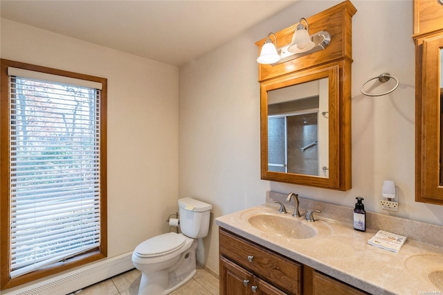 bathroom featuring tile patterned flooring, vanity, a baseboard radiator, and toilet