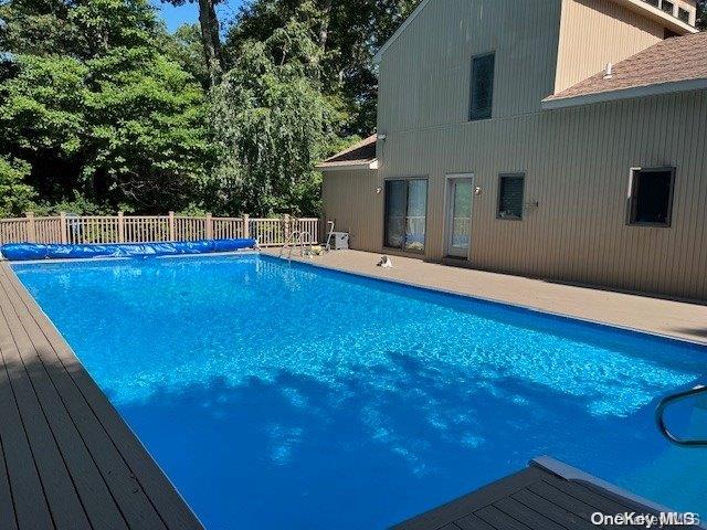 view of pool with a deck