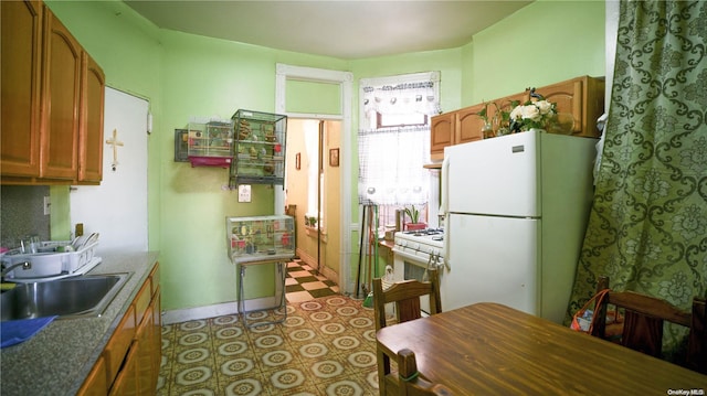 kitchen with sink and white appliances