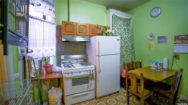 kitchen with under cabinet range hood, white appliances, and brown cabinets