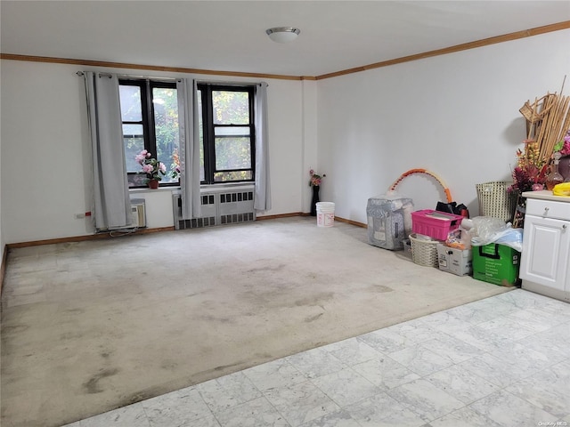 empty room featuring radiator heating unit and ornamental molding