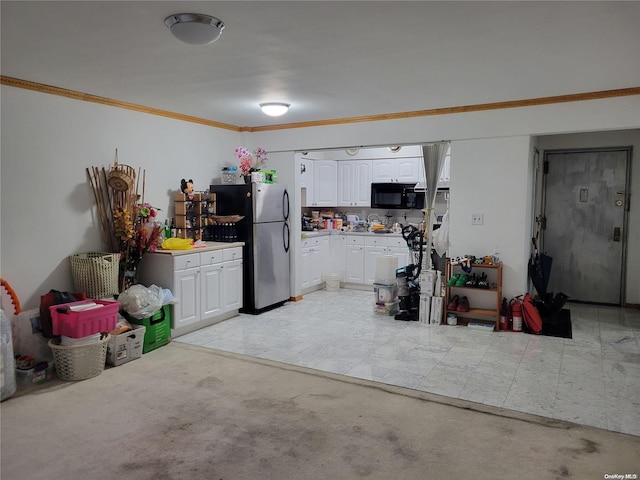 garage with stainless steel fridge