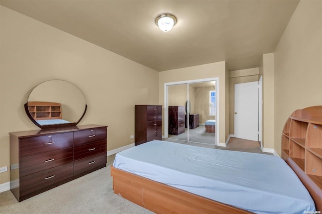 carpeted bedroom featuring a closet