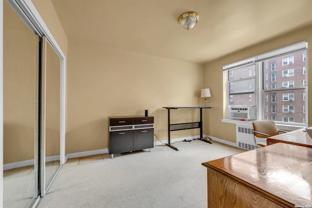 home office with cooling unit, radiator, and light colored carpet