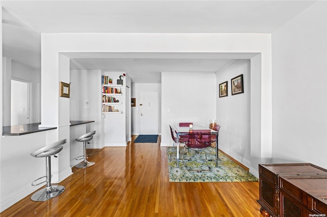 dining area with hardwood / wood-style floors