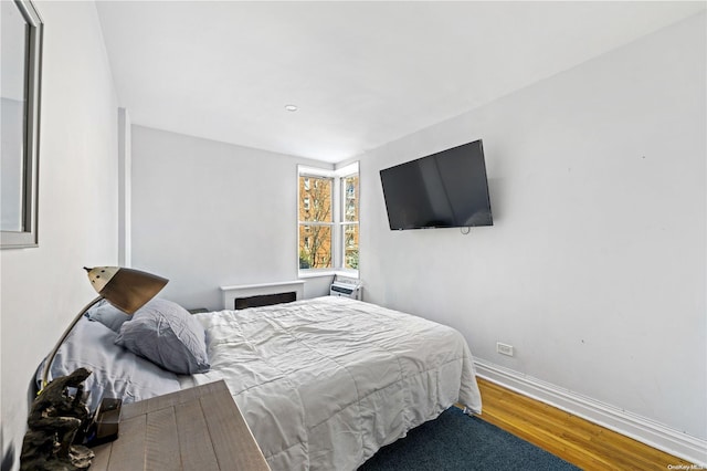 bedroom with hardwood / wood-style floors