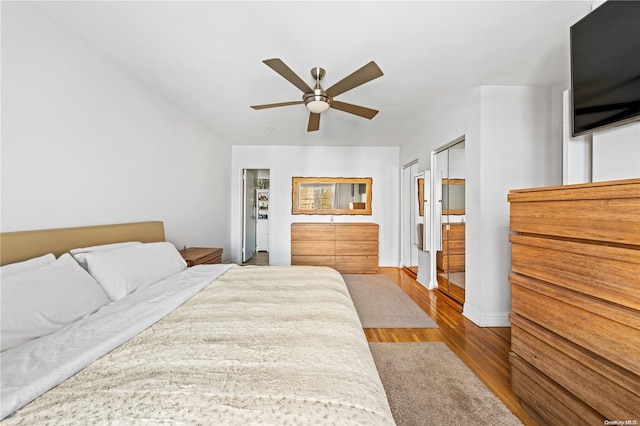 bedroom featuring hardwood / wood-style flooring and ceiling fan