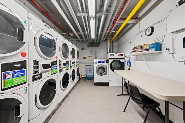 washroom with washer and clothes dryer and stacked washing maching and dryer