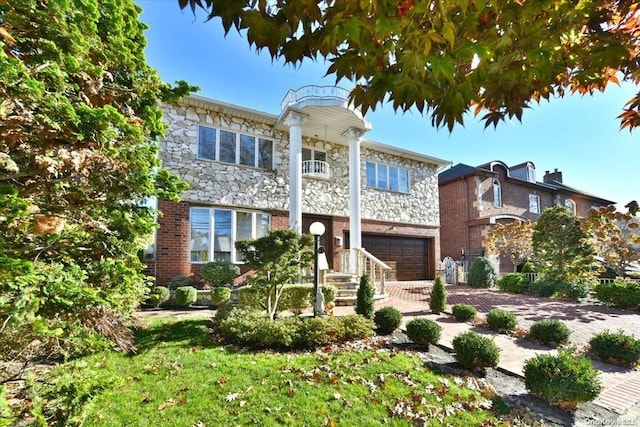 view of front of property with a garage