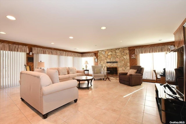 tiled living room with a fireplace