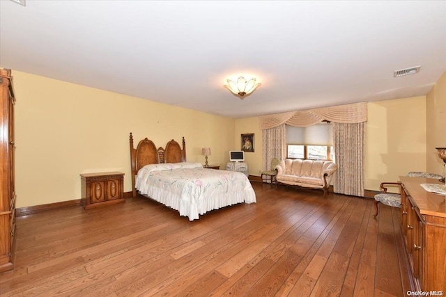 bedroom with wood-type flooring