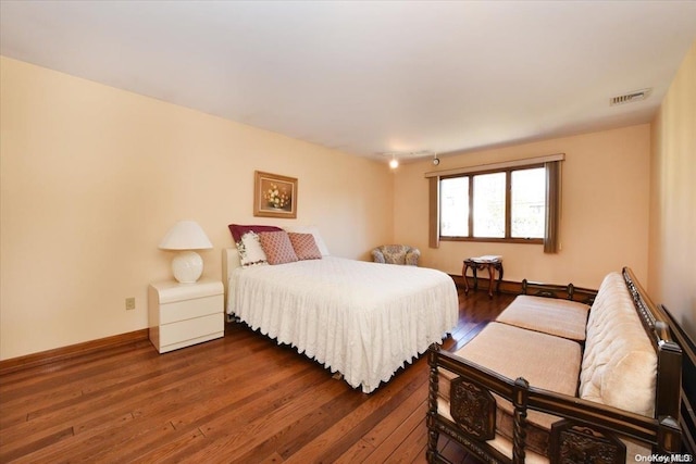 bedroom featuring dark wood-type flooring