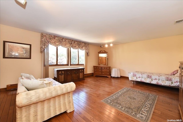 living room featuring dark hardwood / wood-style flooring and a baseboard radiator