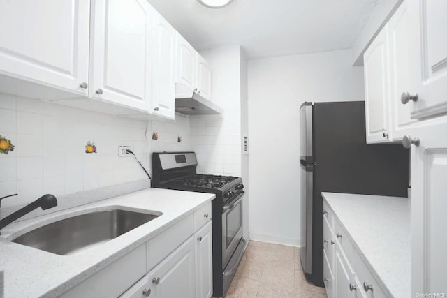 kitchen featuring backsplash, sink, white cabinetry, and stainless steel appliances