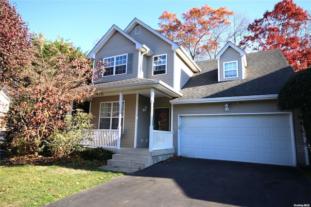 view of front facade with covered porch and a garage