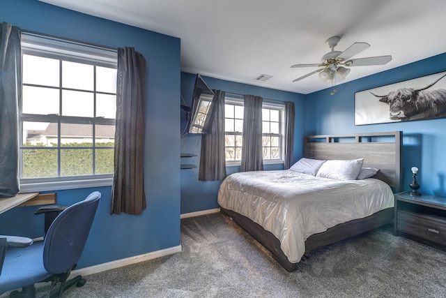 bedroom featuring ceiling fan and carpet