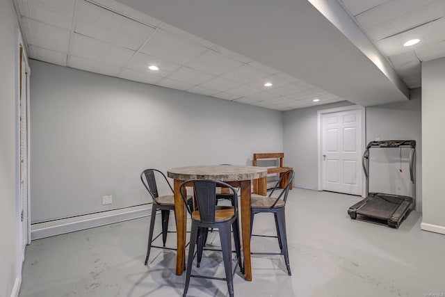 dining space featuring a drop ceiling